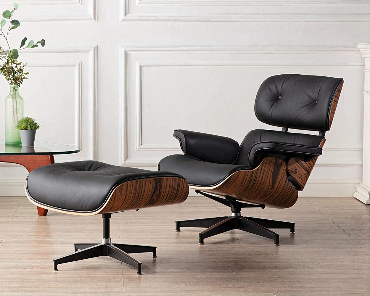 dark spruce wood chair and ottoman with black leather cushioning.