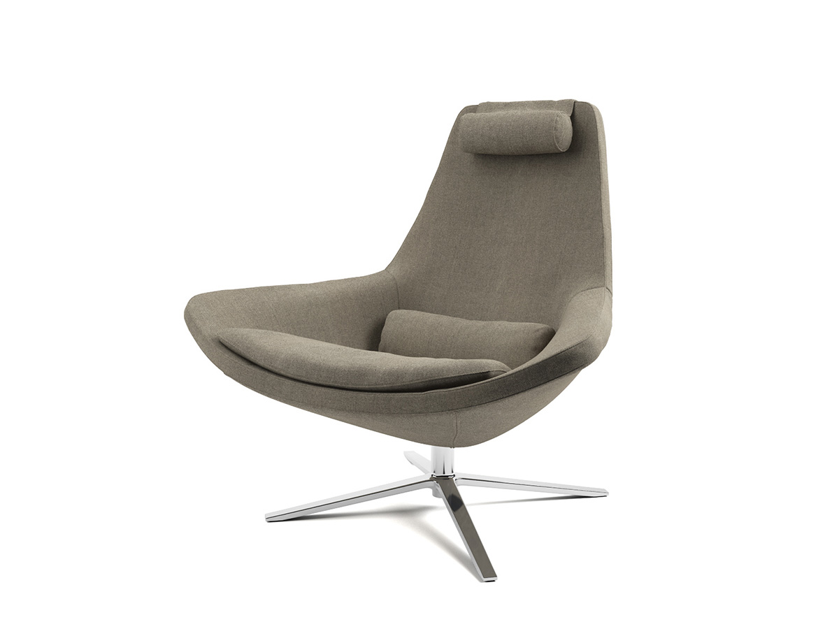 Light brown leather chair with rounded seat and matching footrest.